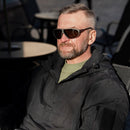 Man wearing black Genuine Swiss army SUVASOL sunglasses designed for outdoor and alpine protection in bright sunlight