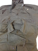 Vintage Czech army M85 field jacket in olive green with button closures and multiple pockets displayed flat.