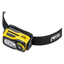 Compact yellow PETZL Swift RL headlamp with adjustable strap and dual LED lights for high-performance outdoor use.