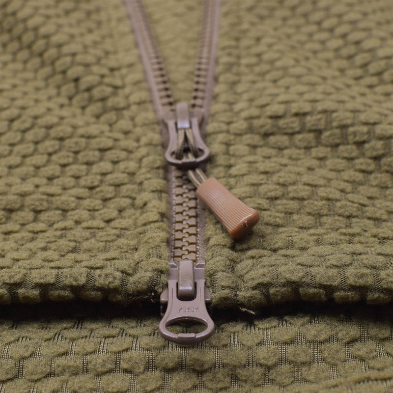 Close-up of coyote-colored hooded thermal fleece jacket zipper with textured military-style fabric detail