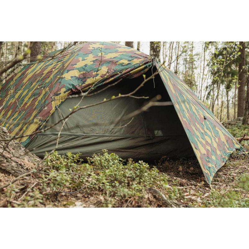 Genuine Belgian military 2-person waterproof ripstop tent set up outdoors in forest with camouflage pattern