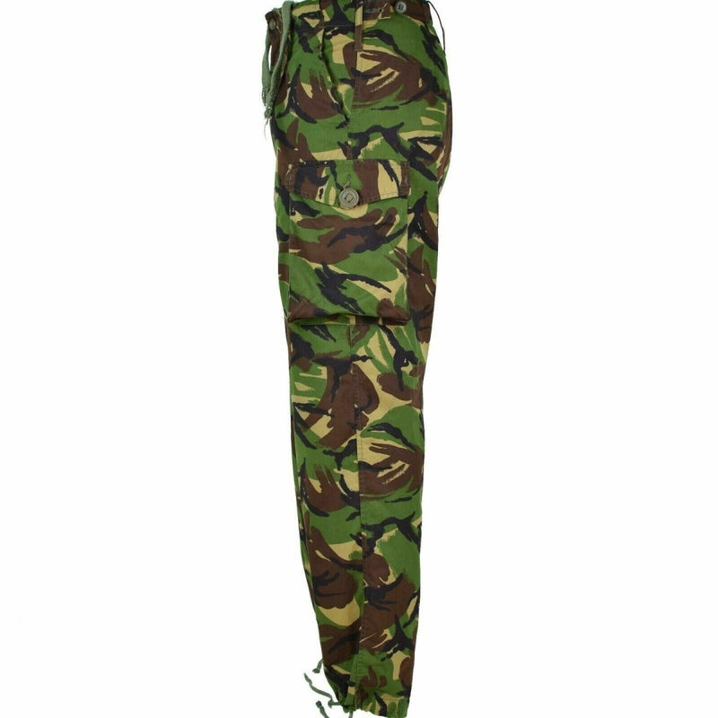 Side view of genuine British army DPM combat trousers in 95 woodland camouflage with cargo pockets and adjustable waist tabs