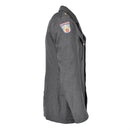 Side view of Danish Civil Defence Forces grey military uniform jacket with emblem on shoulder and gold buttons