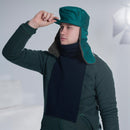 Man wearing a genuine Dutch army blue neck tube scarf and green winter military hat indoors