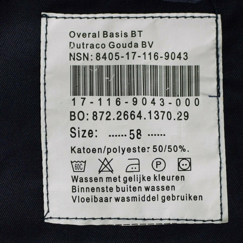 Close-up of a clothing label on a Dutch navy blue coverall showing size 58 and fabric care instructions