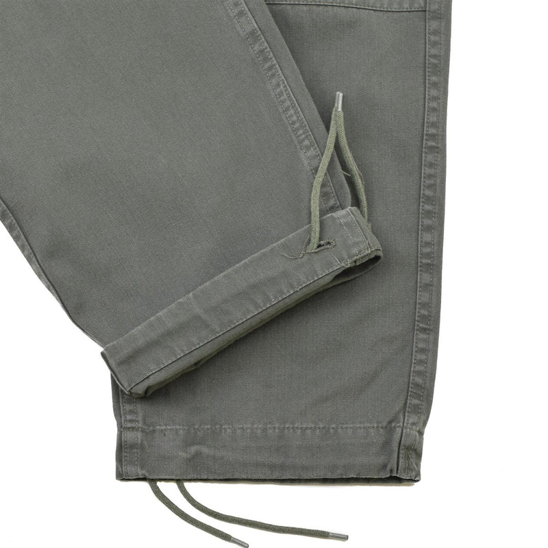 Close-up of gray reinforced knee Genuine French Military Air Forces cargo pants with drawstring cuffs