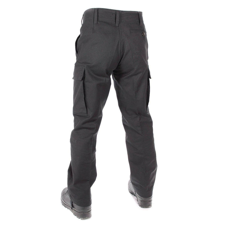 Back view of genuine German Army black moleskin cargo pants with belt loops and pocket closures.