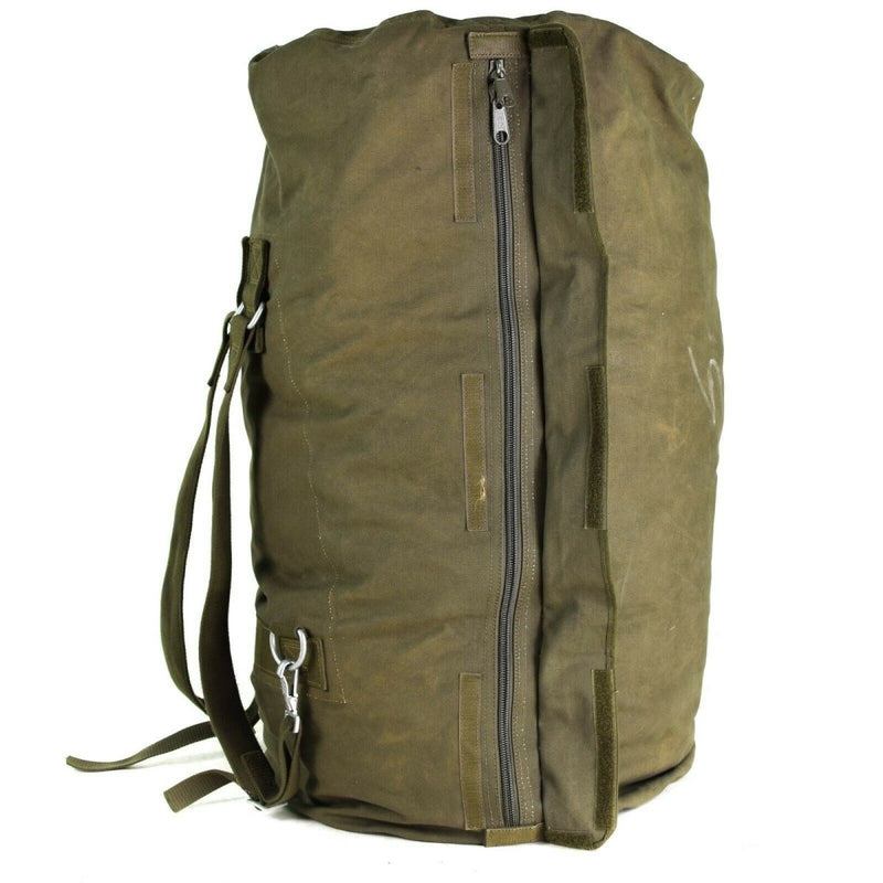 Large olive green genuine German army sea sack duffel bag with shoulder straps and front zipper closure.