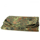 Folded German army Flecktarn camouflage waterproof shelter half tarpaulin with metal eyelets for tent setup or poncho use.