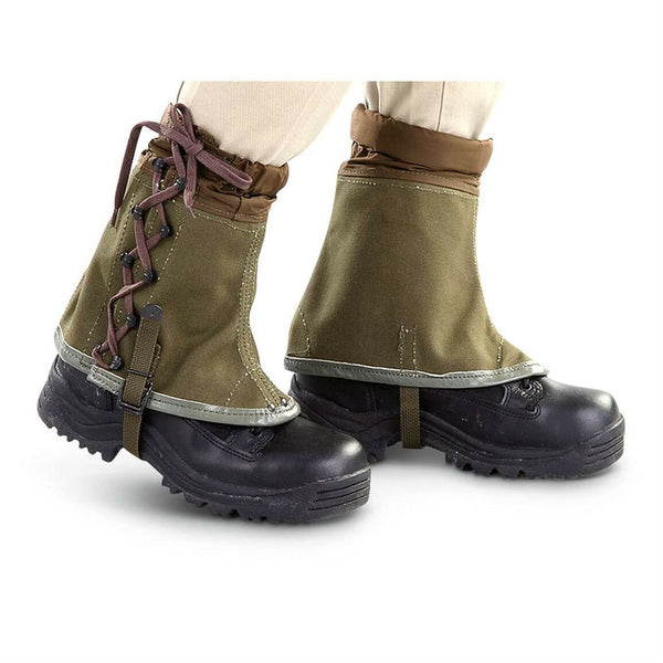 Vintage genuine Italian army olive canvas hiking gaiters with lace-up front and ankle straps on black boots