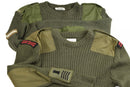 Two British Army green wool commando sweaters with reinforced shoulders and military patches displayed folded.