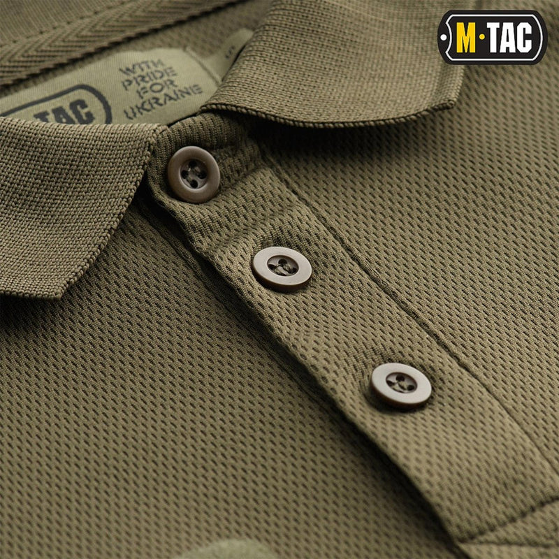Close-up of olive green M-TAC military style breathable tactical polo shirt with buttons and textured fabric