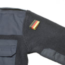 Gray protective gear with a colorful patch on a white background