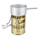 Compact brass Optimus Svea liquid fuel camp stove with pot and handle for outdoor cooking and hiking.