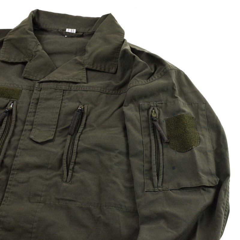 Original Austrian BH army combat shirt jacket in olive drab ripstop fabric with zipped chest and arm pockets.