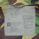 Close-up of label inside British army BDU combat smock jacket showing size, care instructions, and cold weather adjustments.