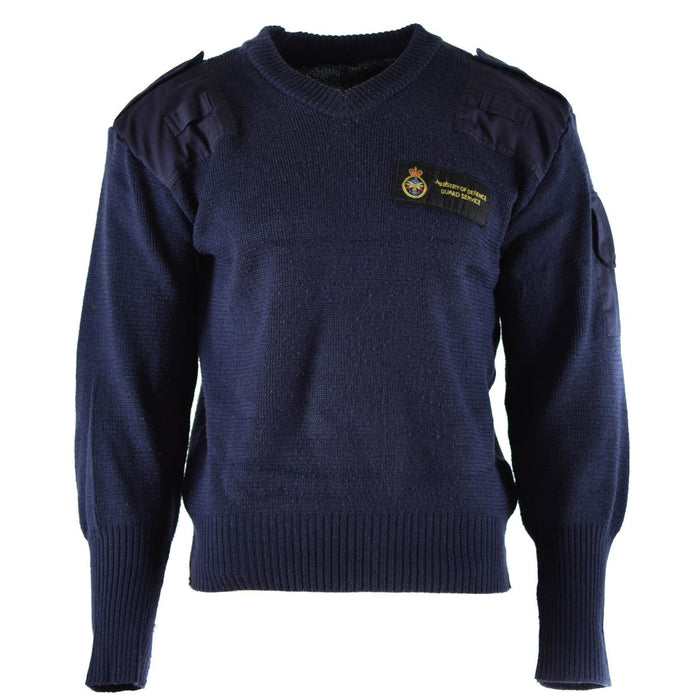 Maglione commando in lana blu con scollo a V originale British Defence Service, spalle rinforzate e tasca applicata.