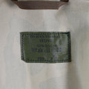 Close-up of the label inside the Original Czech army desert camo windproof parka jacket showing fabric and care details.