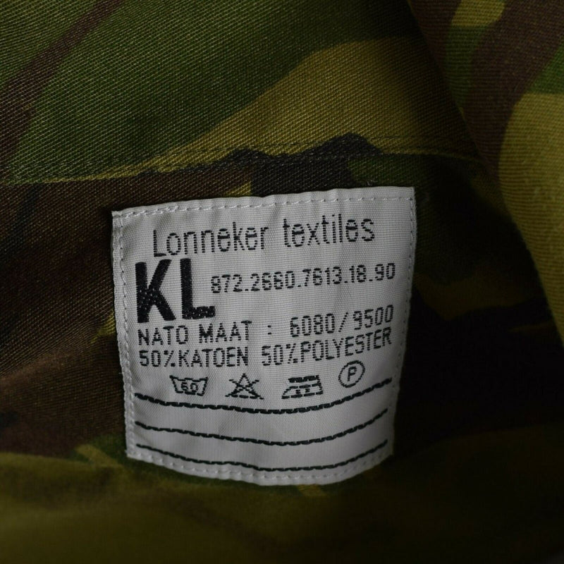 Close-up of the Dutch Army M65 woodland DPM shirt fabric label showing composition and care instructions