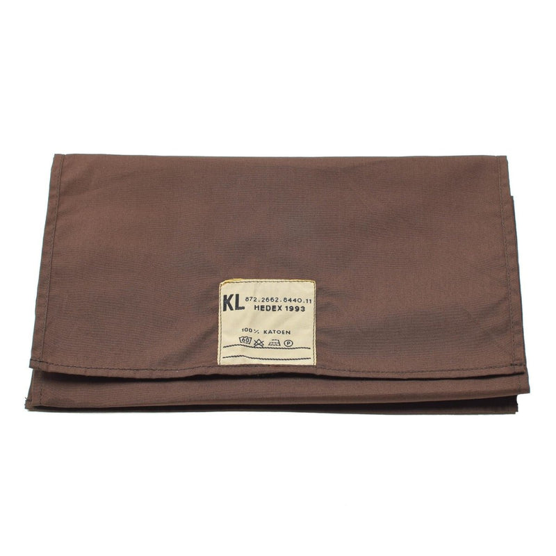 Folded brown fabric with a label on a white background