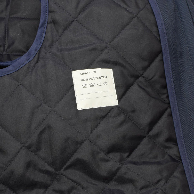 Close-up of the quilted polyester lining inside the Original Dutch Military women's blue trench coat.
