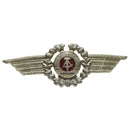 Original East German NVA DDR military officer cap cockade pin badge with silver wings and red emblem center
