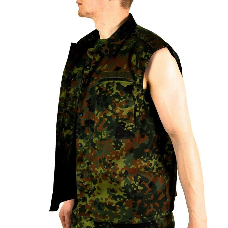 Side view of sleeveless German Army Flecktarn camo tactical vest with zipped front and multiple pockets