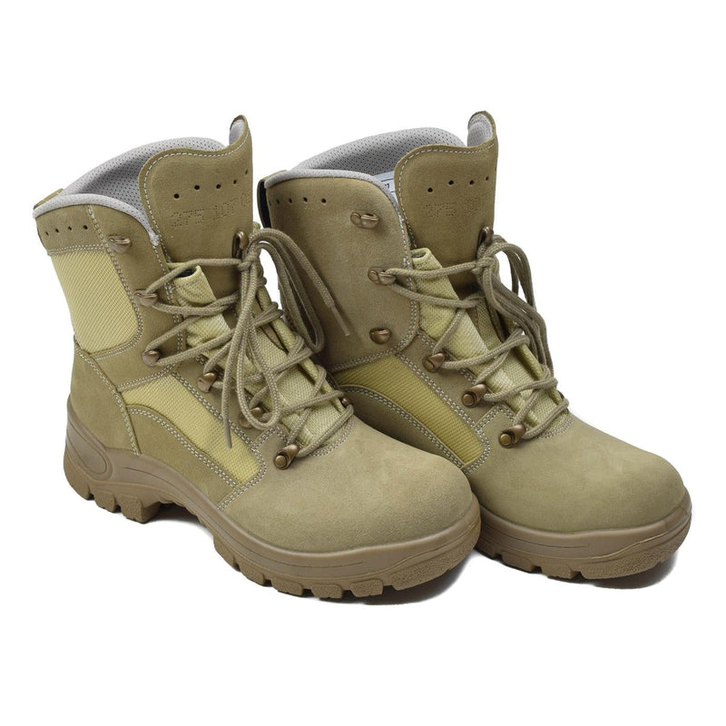 Original German military tactical boots waterproof khaki with rubber round sole and lace closure pair isolated on white