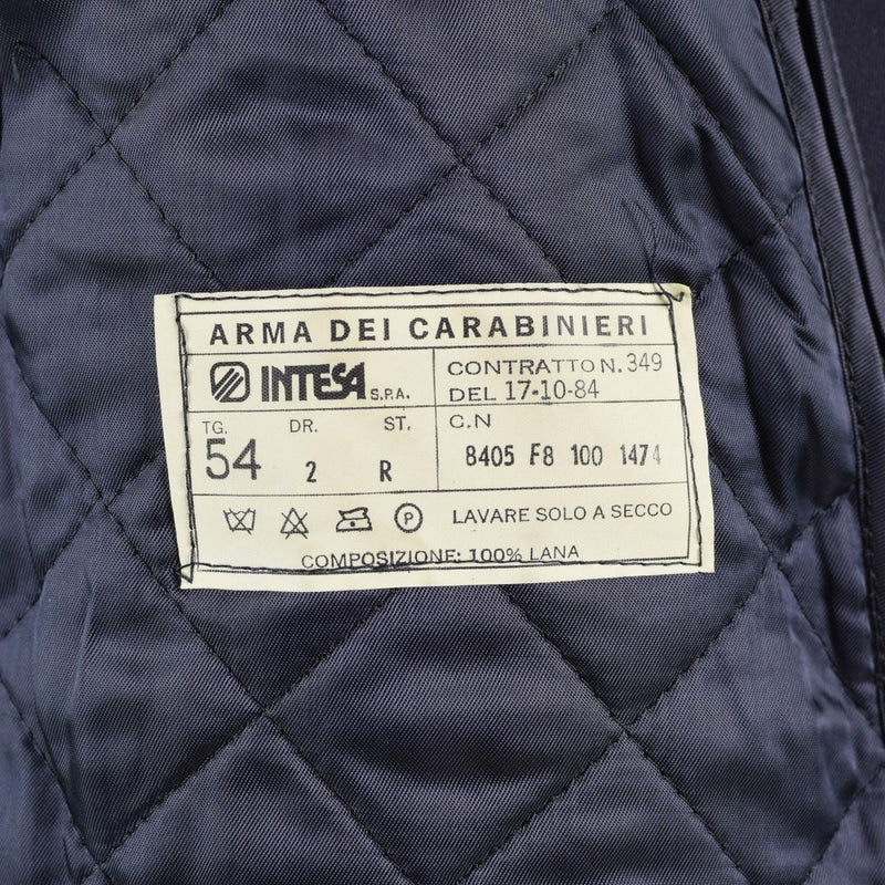 Close-up of vintage Italian Military Police coat label showing size, fabric, and care instructions on quilted lining