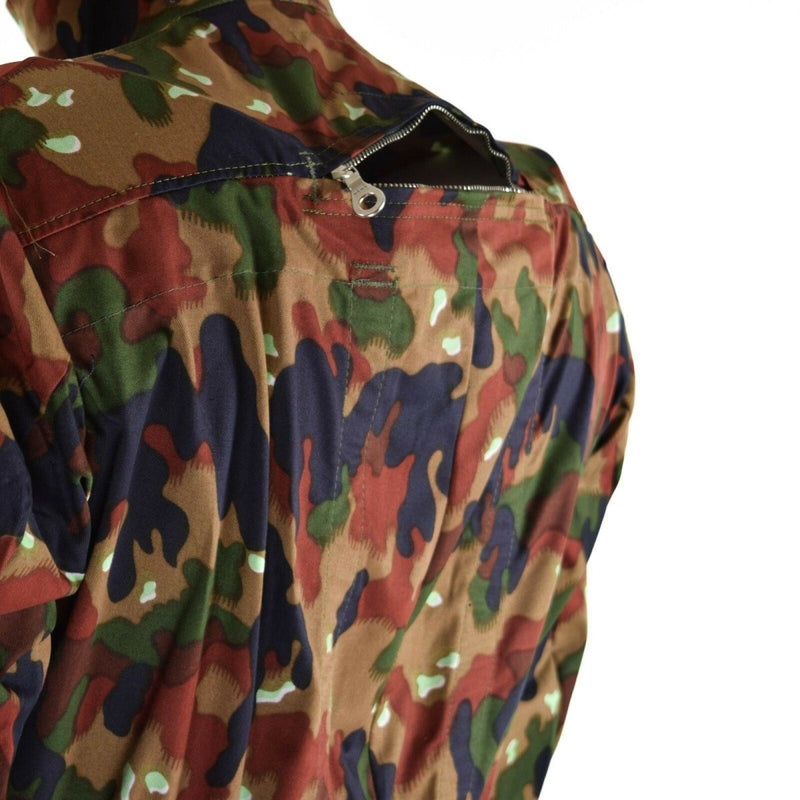 Close-up of Swiss army Alpenflage coverall suit showing back zippered pocket and camouflage pattern details.