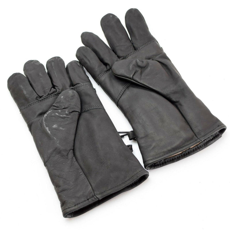 Pair of original US Army combat black leather insulated gloves with wrist straps for durable hand protection