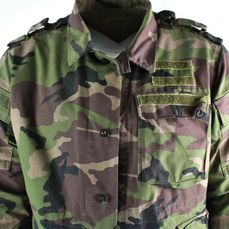 Vintage Slovakian army field jacket M97 camouflage with multiple pockets, epaulets, and hook and loop patch attachments