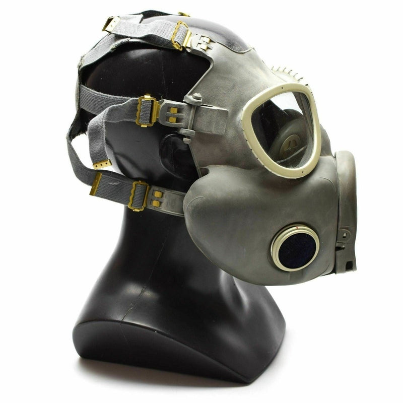 Polish Military MP-4 vintage gas mask in olive green with rubber facepiece and adjustable straps on black mannequin head