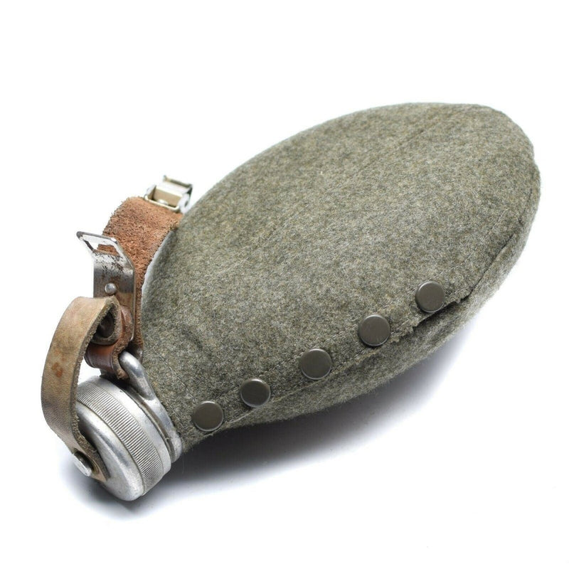 Original WWII Swedish Army metal drinking flask with protective wool pouch and leather strap for carrying in the field.